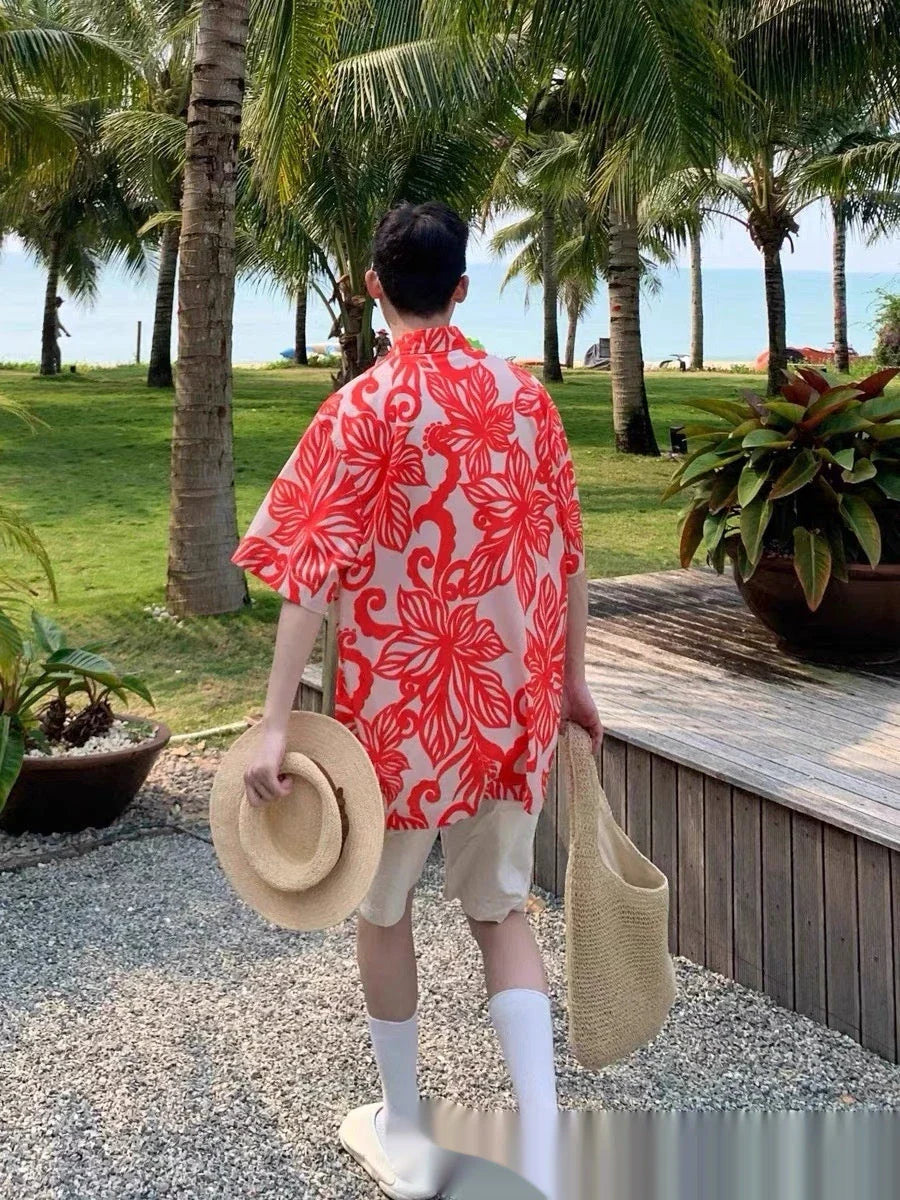 A stylish, short-sleeved shirt in a vibrant red colour with a delightful vine print pattern, perfect for casual or smart-casual occasions.