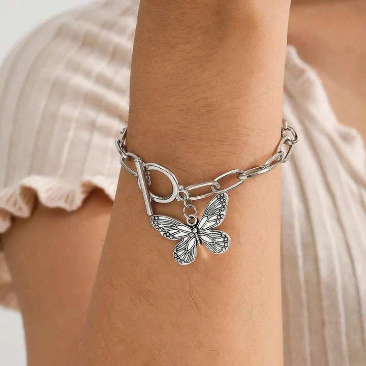 Silver butterfly pendant bracelet with a delicate chain and charming bowknot design