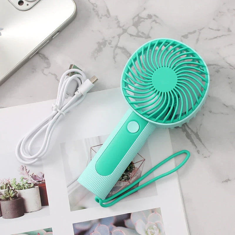 Mini Handheld USB Rechargeable Fan with 3 wind speed settings, rechargeable battery, and integrated night light