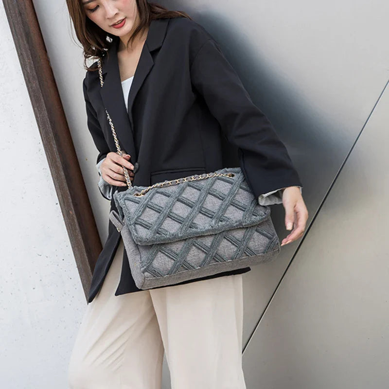A stylish, retro-inspired shoulder bag with a minimalist rhombus pattern design, perfect for the modern, fashion-conscious woman in the UK.