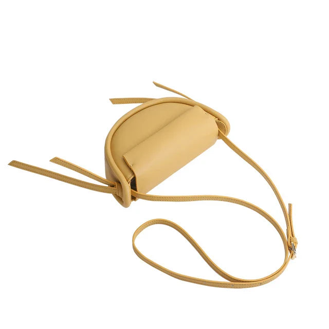 Premium cowhide leather crossbody bag in a distinctive semicircle shape, available in classic colours to complement any UK wardrobe