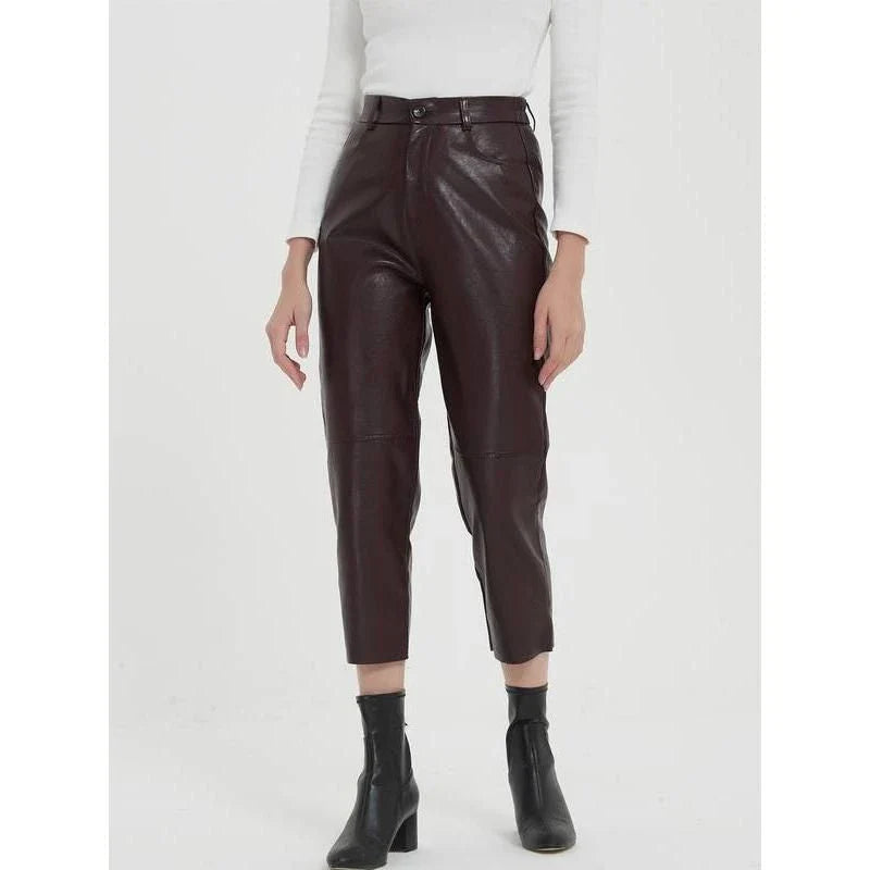 Pair of high-waisted, ankle-length faux leather trousers in a classic brown colour