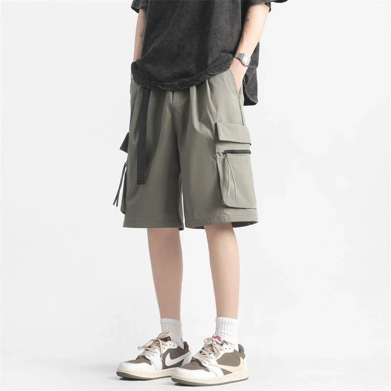 Trendy multi-pocket workwear shorts in a variety of colours, including black, khaki, green, and light grey, with a straight-leg design and ample storage options.