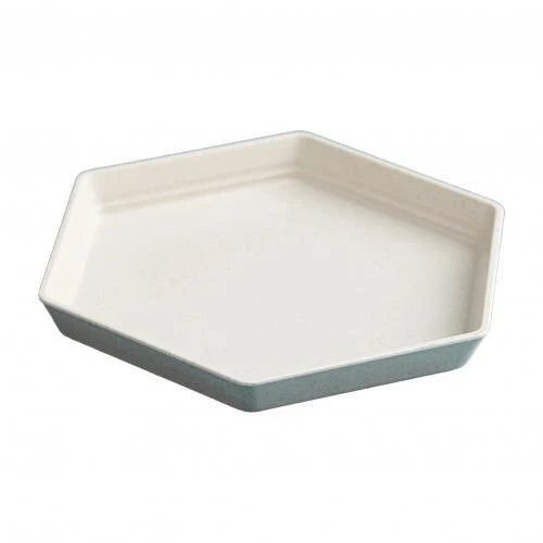 Hexagon-shaped wheat straw plate in a neutral beige colour, showcasing a modern and eco-friendly design