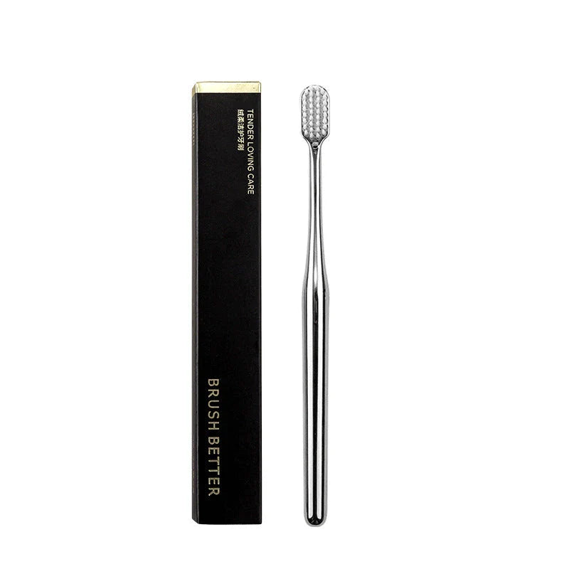 Elegant gold and silver toothbrush with soft bristles for superior dental hygiene