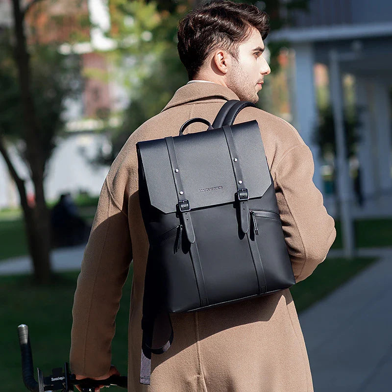A stylish and functional large capacity backpack in black, featuring multiple pockets and a dedicated laptop compartment for school, travel, and work use.