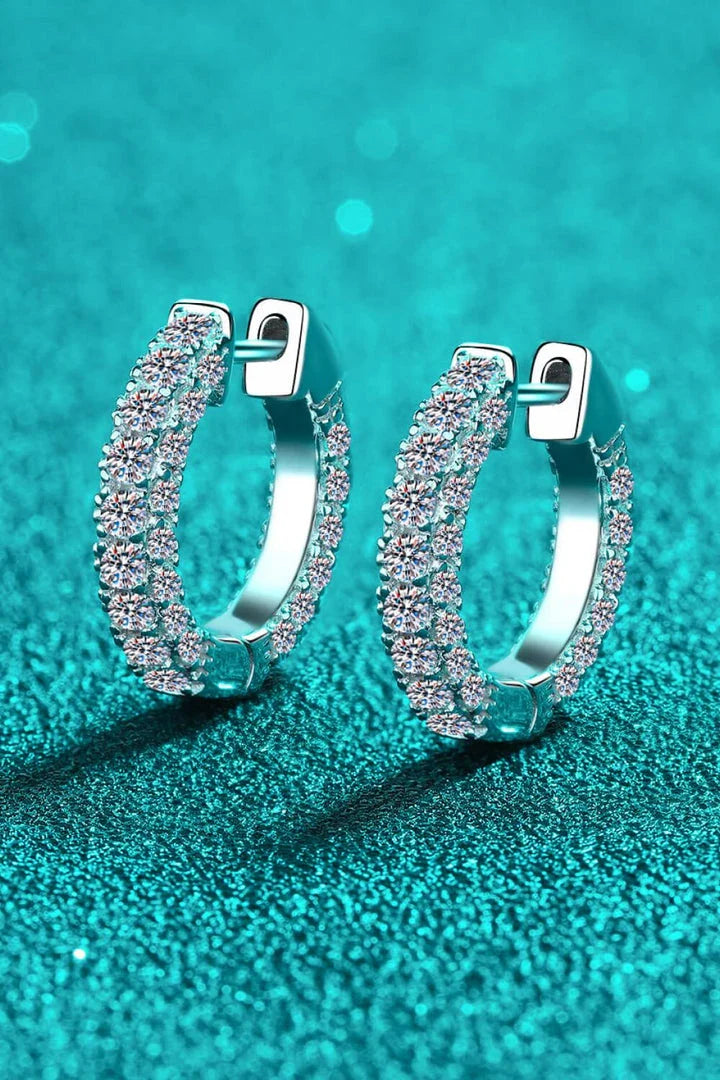 Elegant 925 sterling silver moissanite huggie earrings with a minimalist design and polished finish