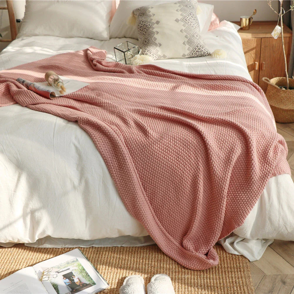 Cosy and sophisticated oversized moss stitch knitted blanket in various colours, perfect for adding warmth and style to any living space