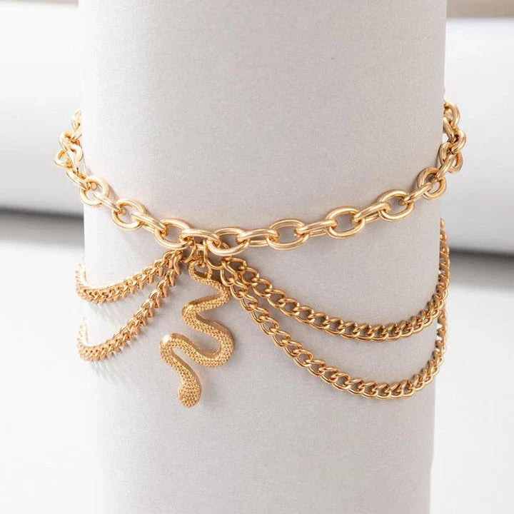 A stylish gold boho anklet with delightful tassels, starfish, and heart charms, perfect for summer outings and everyday wear.