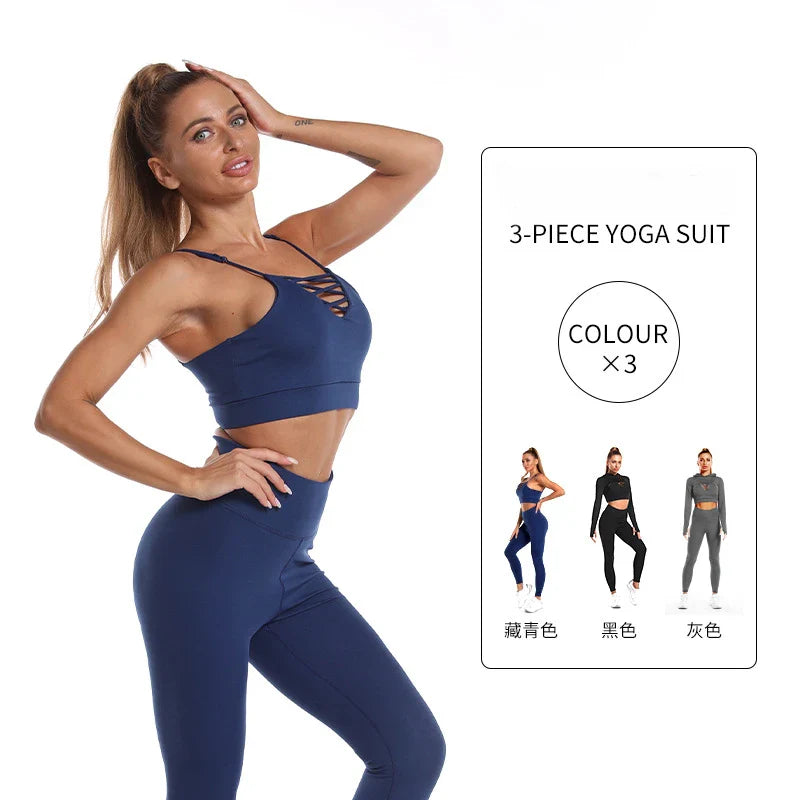 A 3-piece sports set including a hooded top, sports bra, and high-waisted leggings in a black colour scheme.