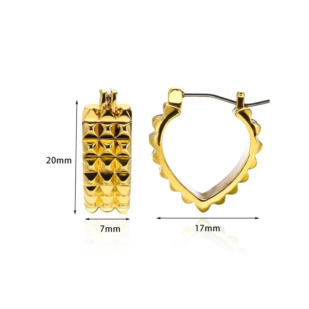A pair of gold-toned stainless steel hoop earrings, showcasing a classic and sophisticated design
