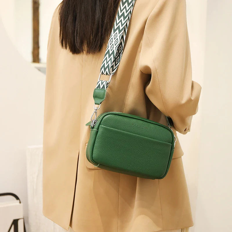 Stylish leather crossbody bag with embroidered strap in various colours
