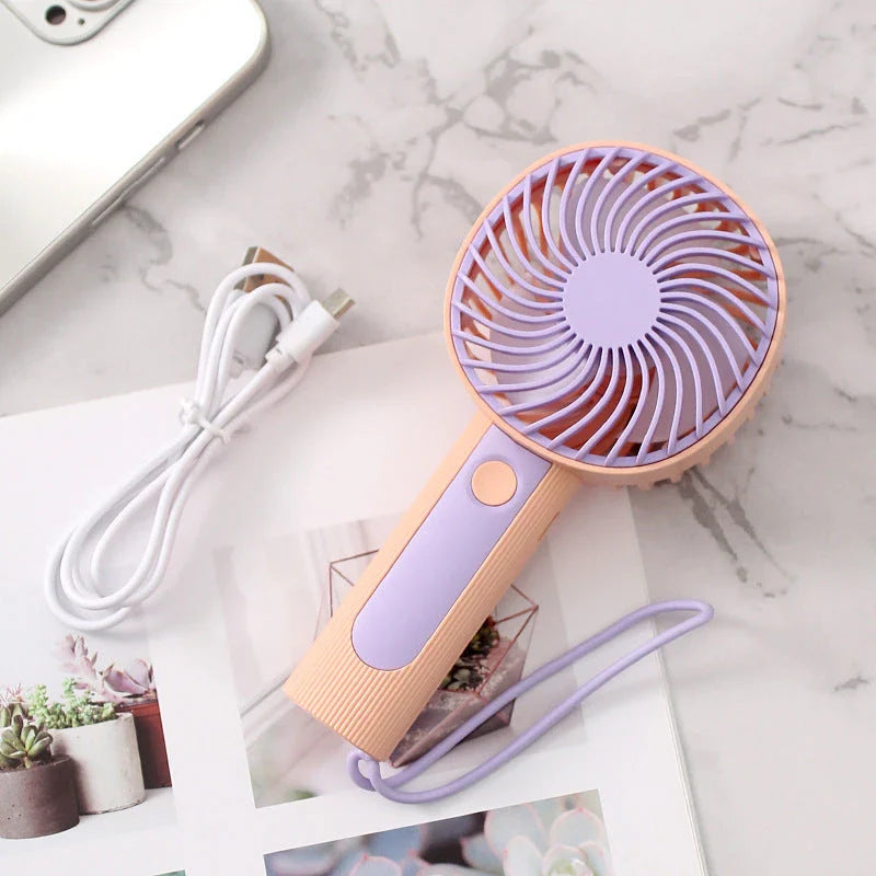 Mini Handheld USB Rechargeable Fan with 3 wind speed settings, rechargeable battery, and integrated night light