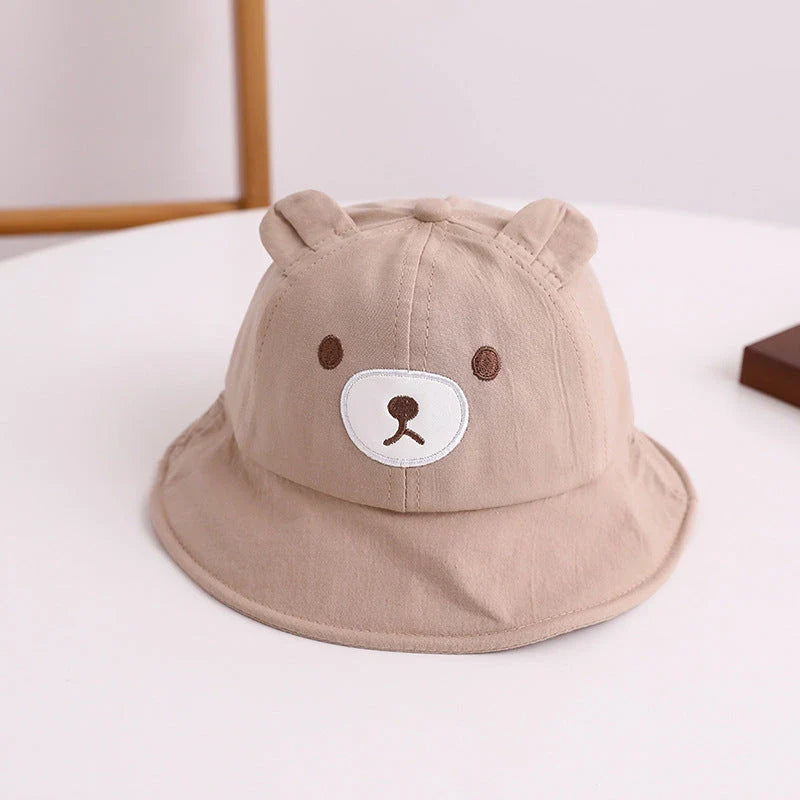Adorable kids' bear-themed panama bucket hat with soft, breathable fabric and adjustable fit for sun protection and style