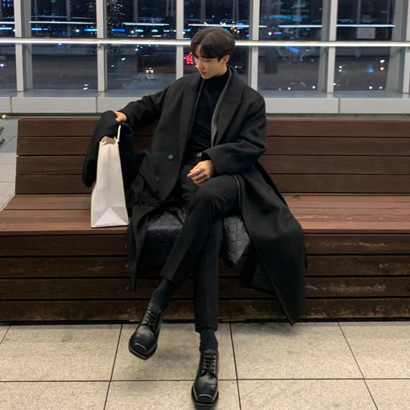 Premium British knee-length trench coat in classic black, featuring a relaxed, comfortable fit and made from a durable polyester-viscose blend.