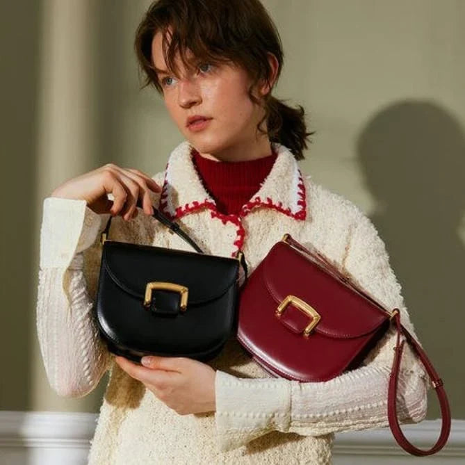 Premium high-end British wedding shoulder bag in brown, with a unique saddle shape design and hardwearing leather exterior