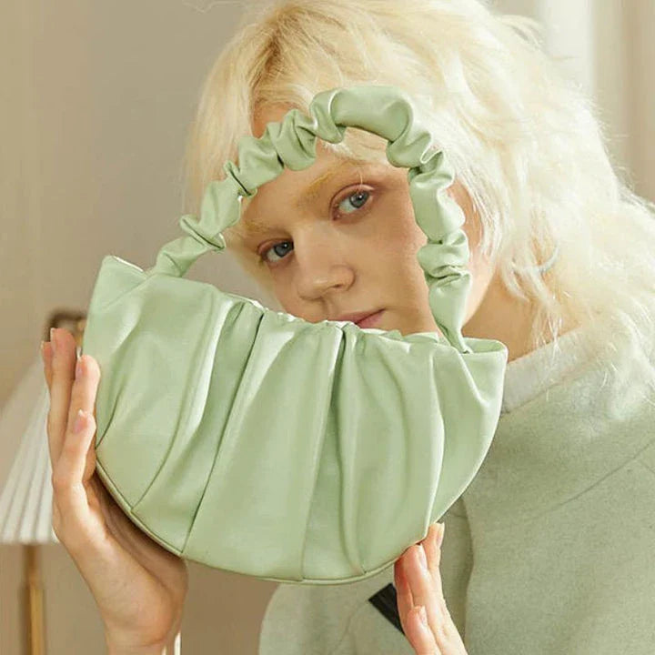 Luxurious sheepskin pleated crossbody bag in various colours, featuring a chic and contemporary design perfect for any occasion.
