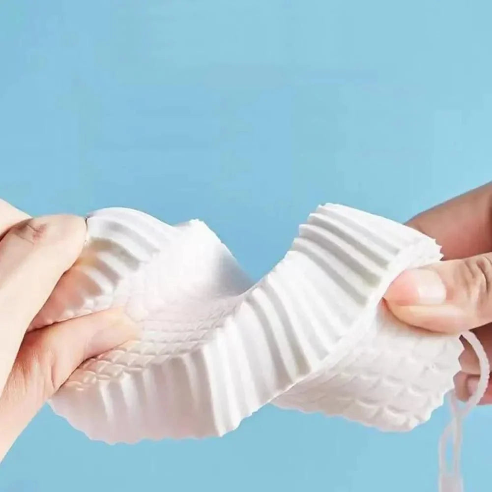Luxurious white exfoliating bath sponge with a unique hardening design for hygienic and convenient use