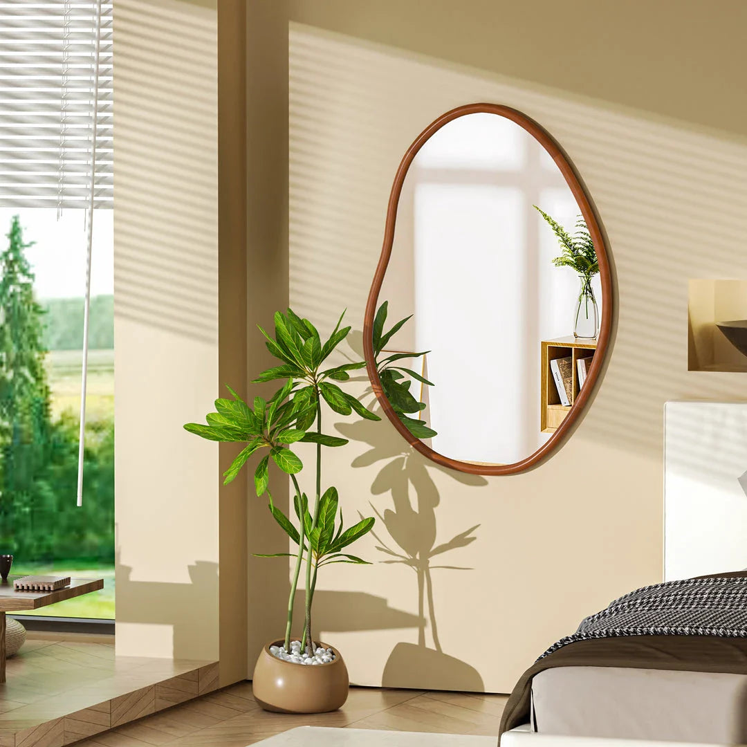 Stylish mid-century asymmetric decorative wall mirror with solid beech wood frame, adding visual interest and reflecting light to create a brighter, more open living space.