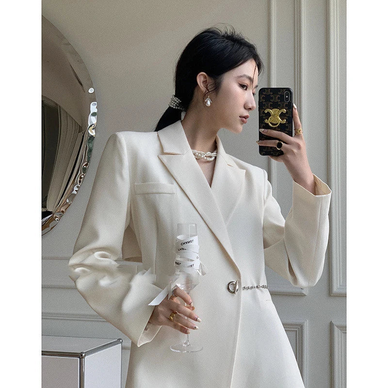 A sophisticated black polyester jacket with a sleek back chain design, perfect for elevating your British fashion style.