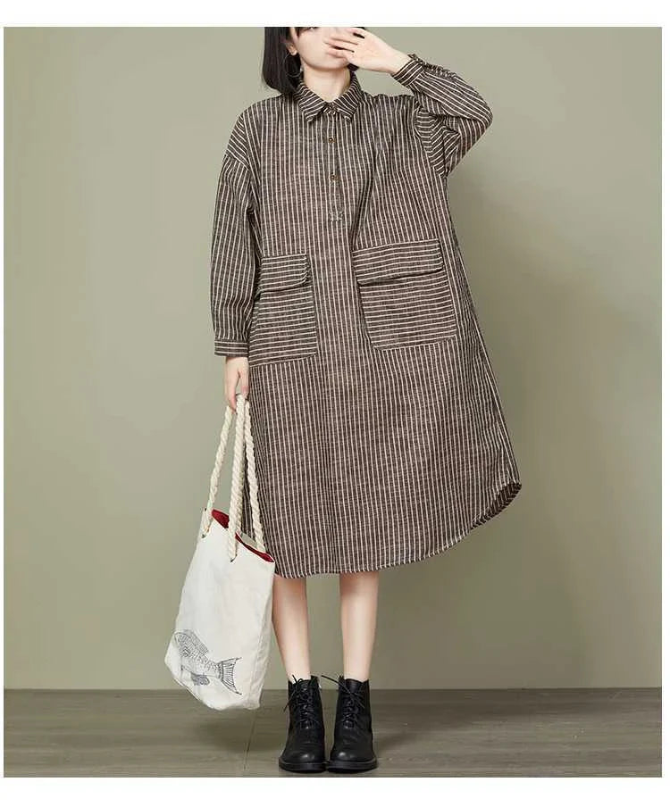 Plus-size women's dress with a striped pattern, asymmetric skirt, and long loose sleeves