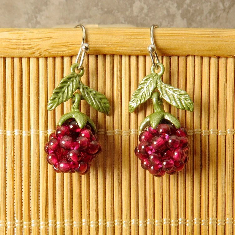Vintage-style raspberry lacquer earrings with garnet accents, showcasing a charming fruit-shaped silhouette and a captivating retro-inspired design.
