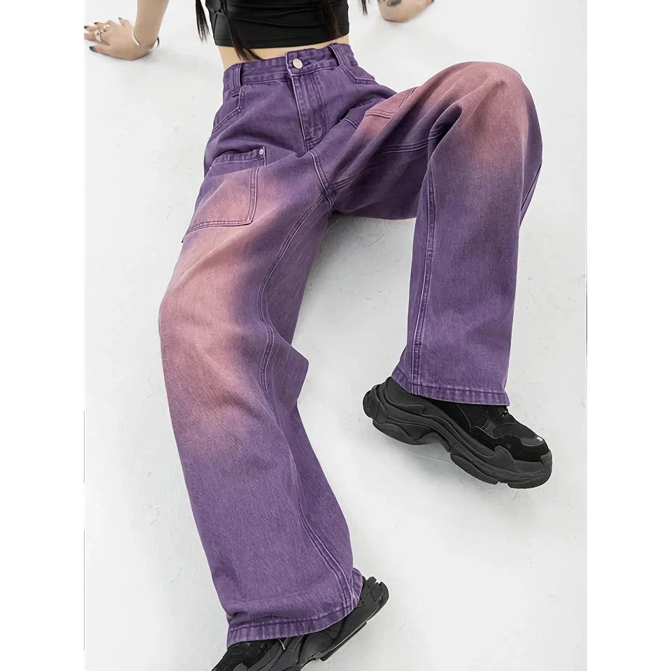 Stylish high-waist purple wide-leg jeans with elegant button details and a premium denim design