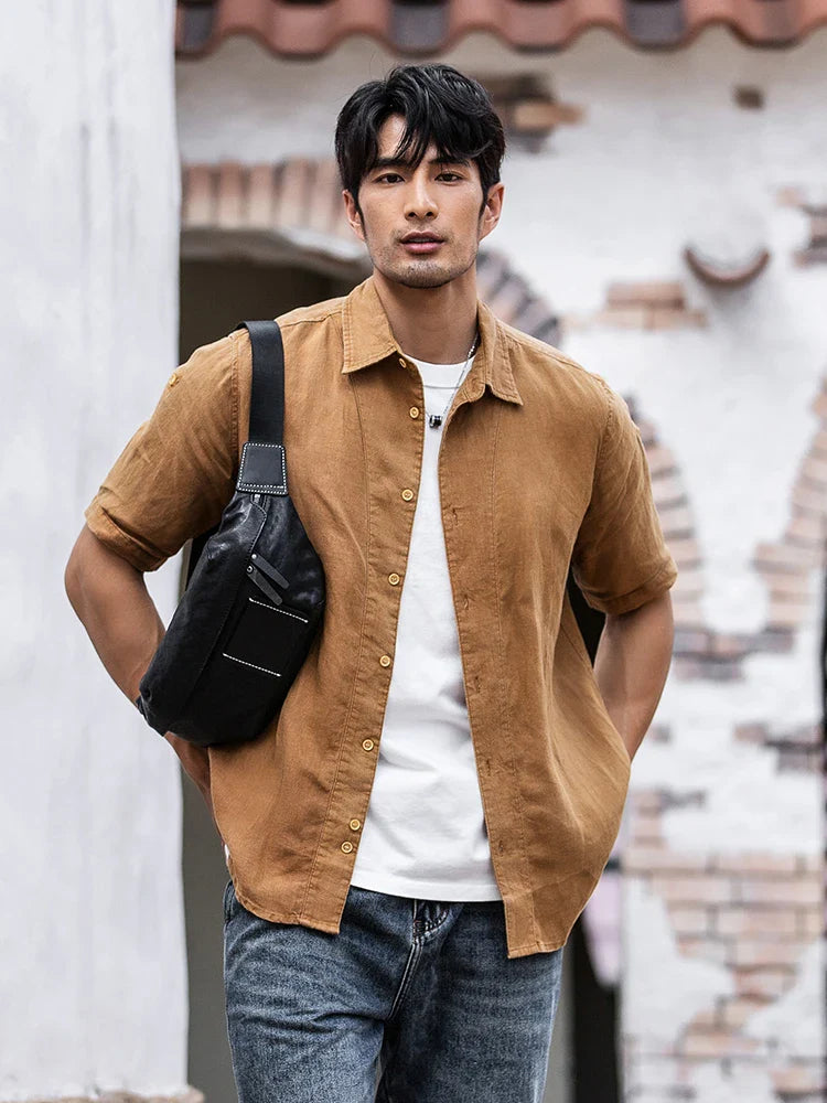 Premium cowhide messenger bag in black, featuring a spacious interior, adjustable shoulder strap, and sleek, minimalist design