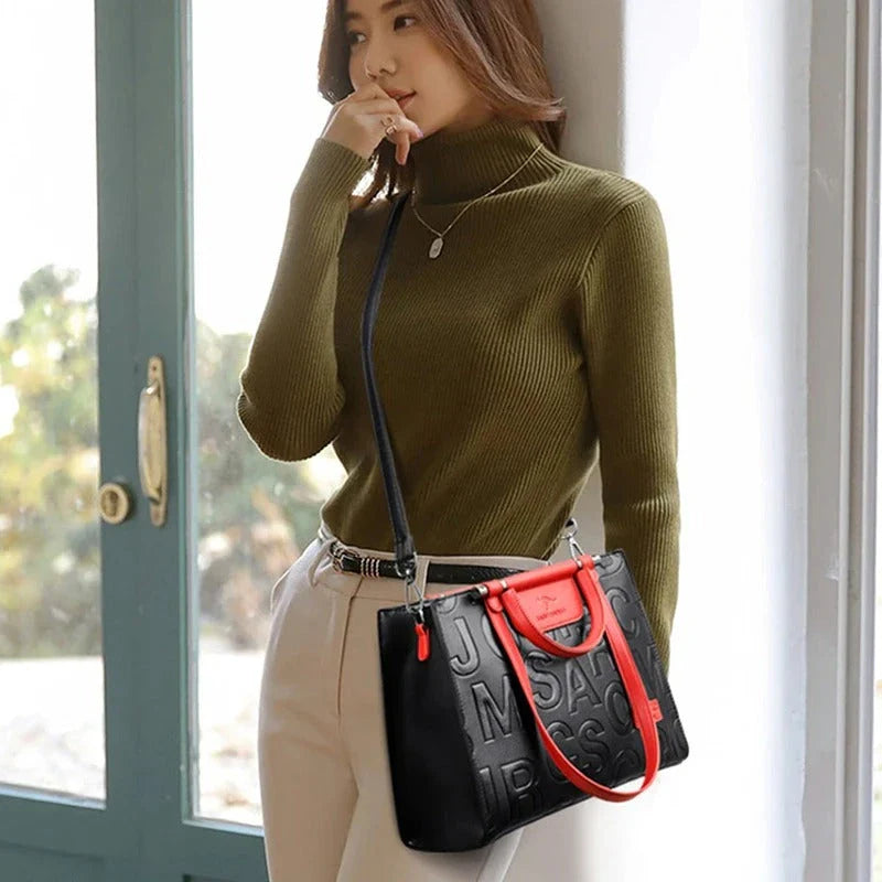 Sophisticated large leather tote bag with embossed lettering design, suitable for daily use and travel