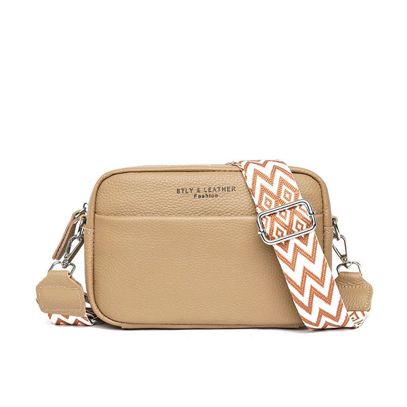 Stylish leather crossbody bag with embroidered strap in various colours