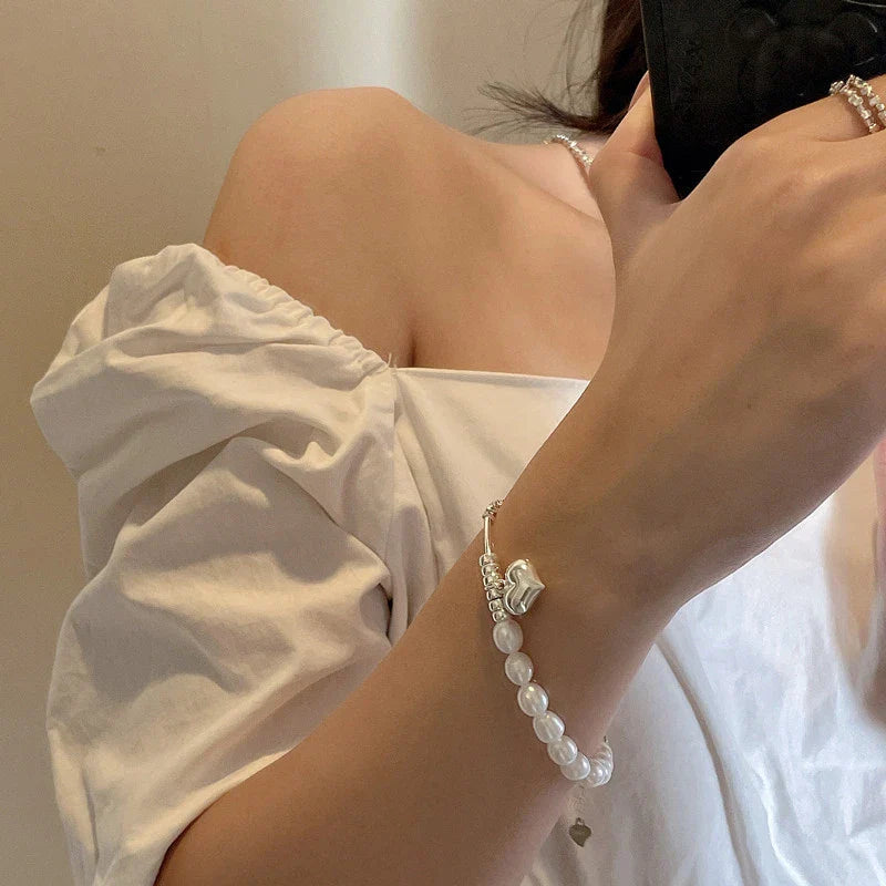 Elegant heart-shaped pearl necklace in sterling silver, a timeless British-inspired accessory