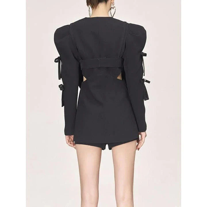 Stylish women's white blazer with a sparkling diamond bow accent, designed for fashion-forward British women