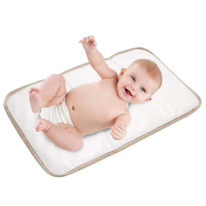 Premium waterproof changing pad for babies, featuring a compact, foldable design and soft, skin-friendly materials for a comfortable, hygienic nappy changing experience on the go.