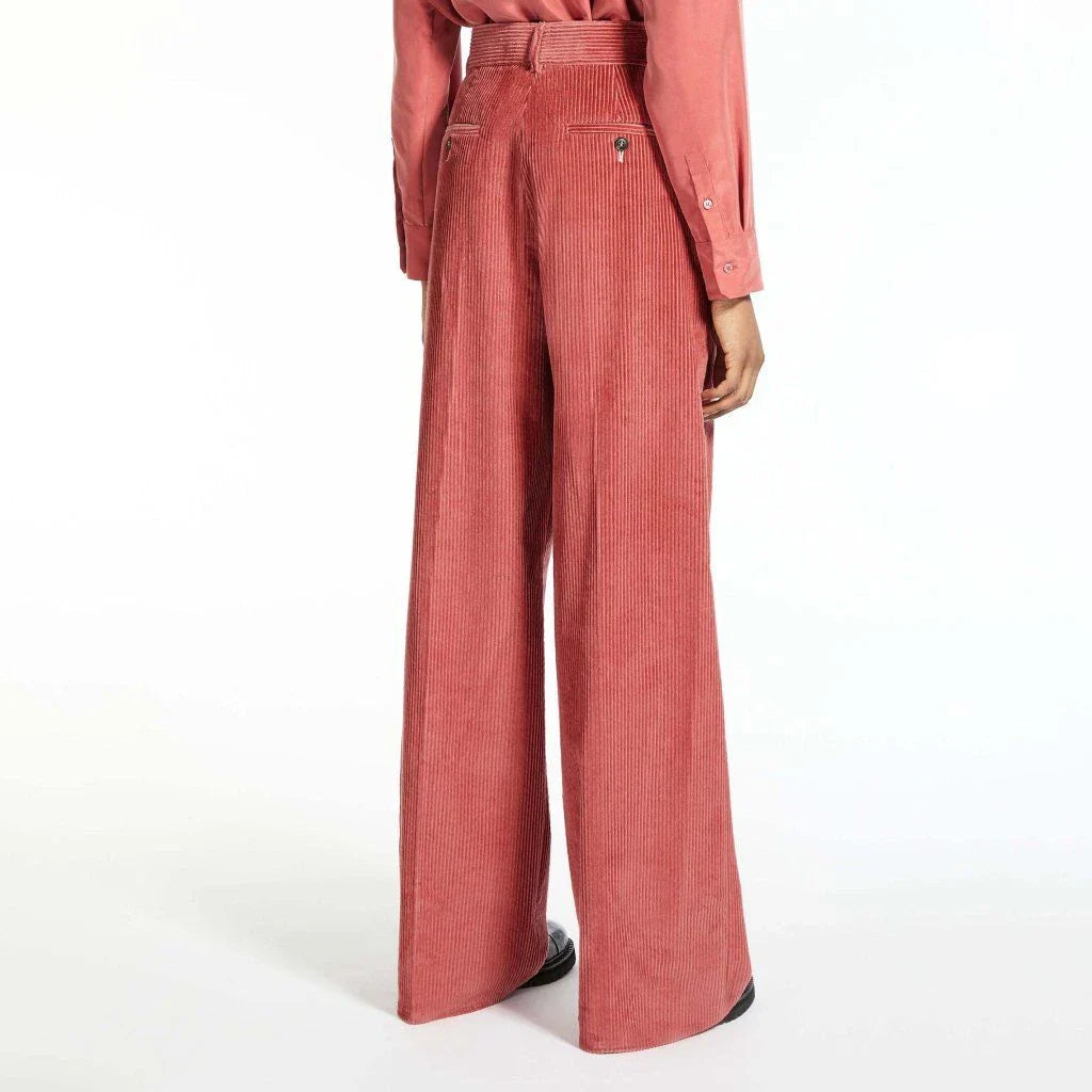 A pair of high-waist, wide-leg corduroy trousers in a classic red colour, designed for the modern British woman's wardrobe.