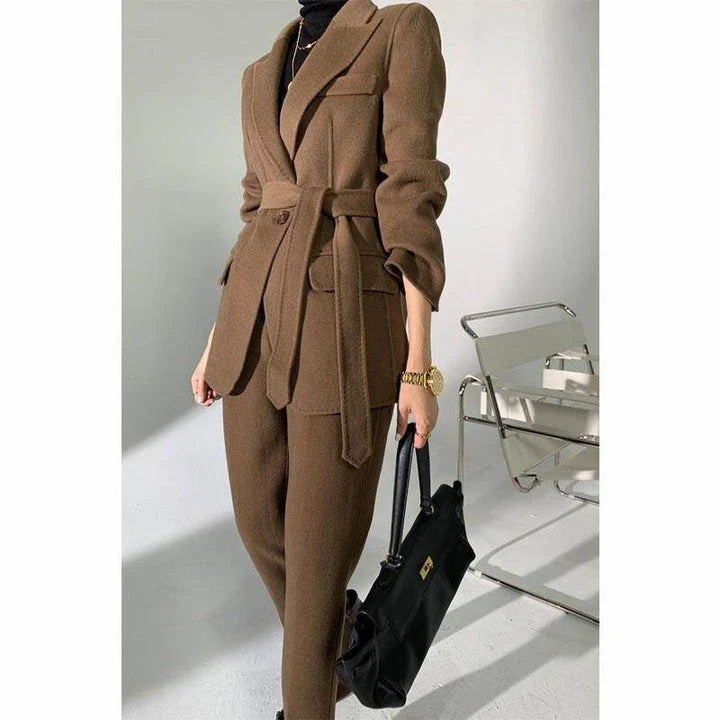 Elegant autumn-winter woollen pant suit with belted jacket and warm trousers for women