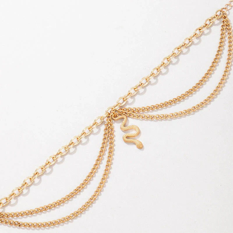 A stylish gold boho anklet with delightful tassels, starfish, and heart charms, perfect for summer outings and everyday wear.