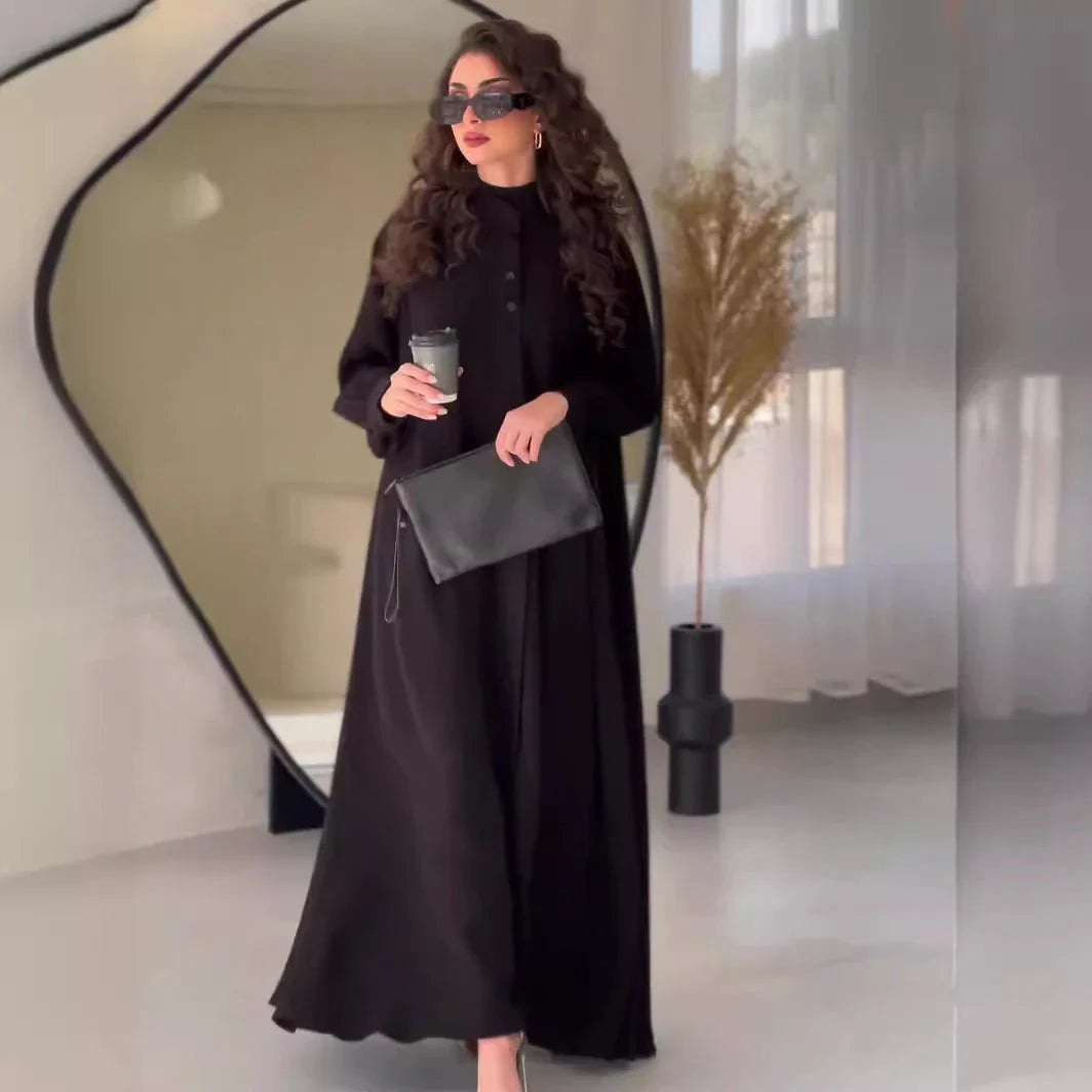 Premium black commuter swing skirt dress with long sleeves and an elegant A-line silhouette