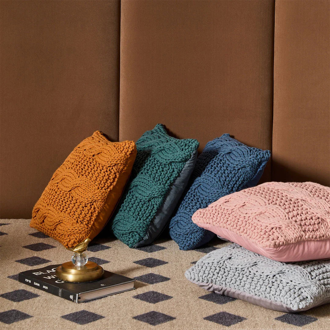Luxurious hand-crocheted chunky knit throw pillow in a range of vibrant colours, providing cosy comfort and sophisticated style.