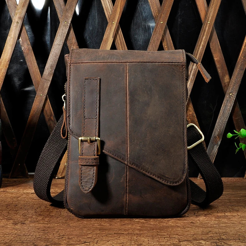 Premium cowhide leather one-shoulder crossbody bag in light grey colour with adjustable strap and zipper pocket