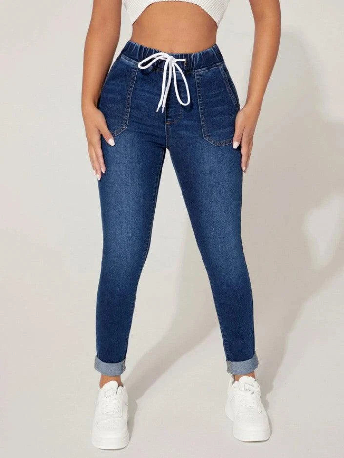 Premium navy blue drawstring waist skinny jeans with a vintage-inspired stone-washed finish