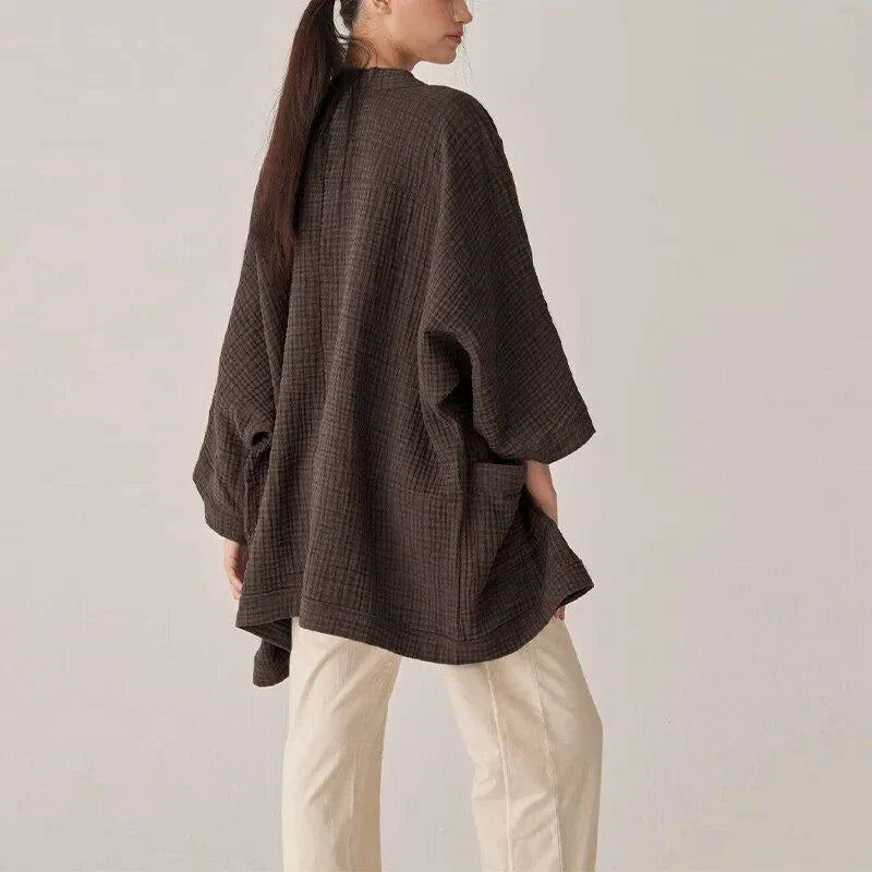 Premium 100% cotton cardigan with elegant open-stitch design, ideal for versatile everyday wear in the UK