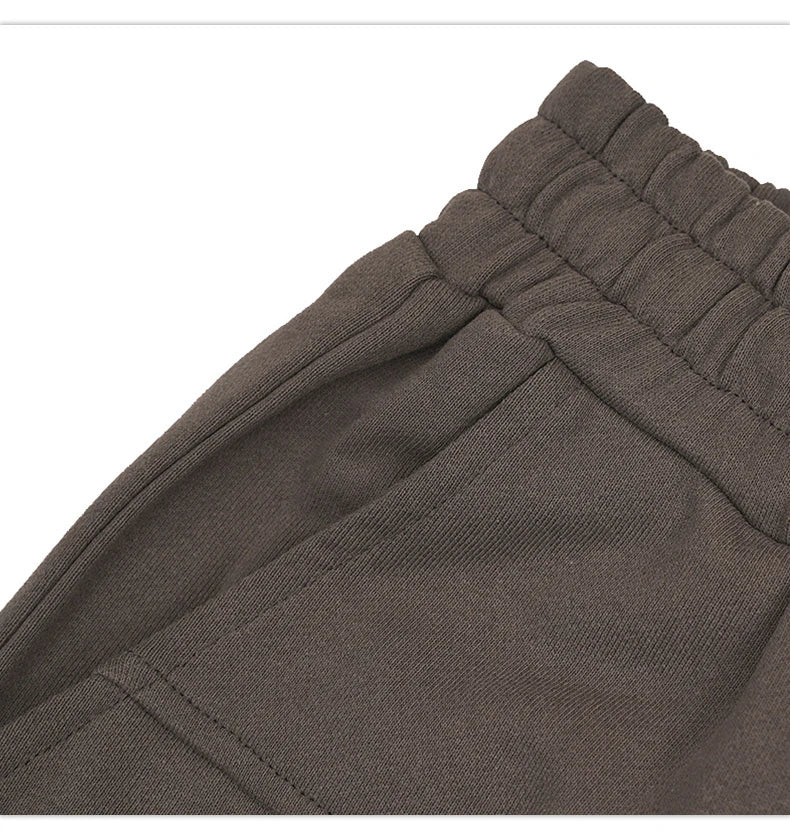 Premium loose-fit sports shorts with eye-catching printed patterns in black, khaki, and dark grey colours