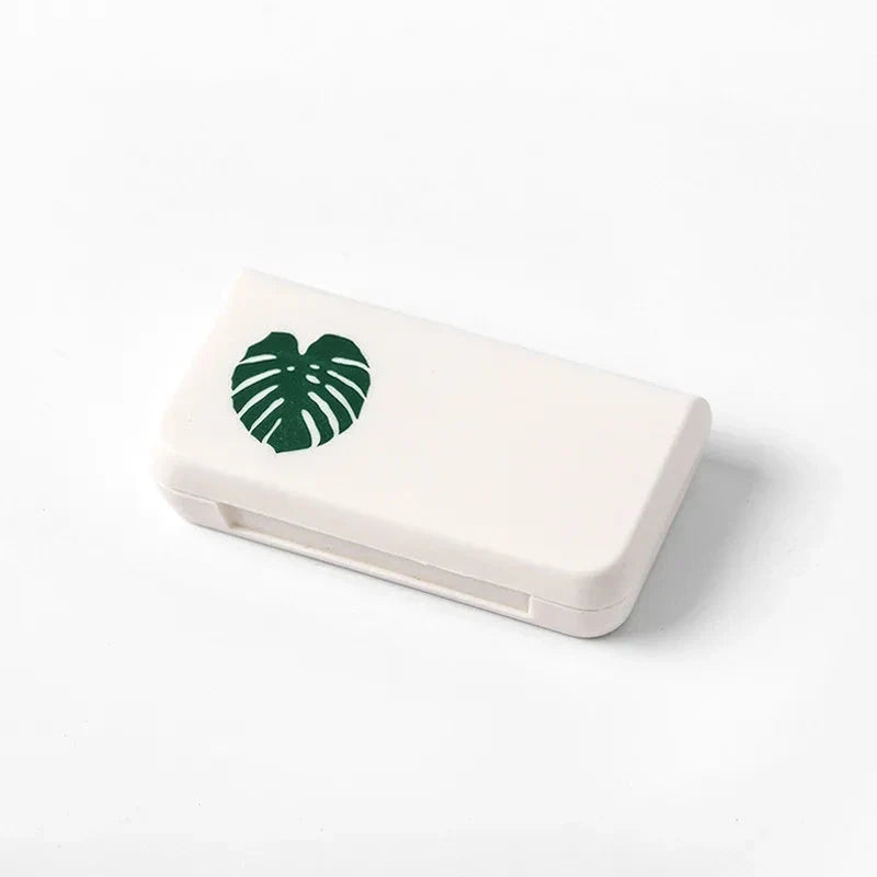 Compact and stylish 3-compartment pill organiser for travelling, made from durable, eco-friendly plastic