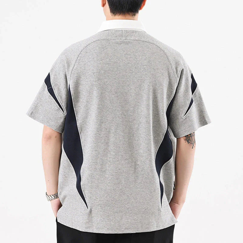 Melange grey polo shirt with contrast stitching, designed and made in Britain for comfortable summer wear