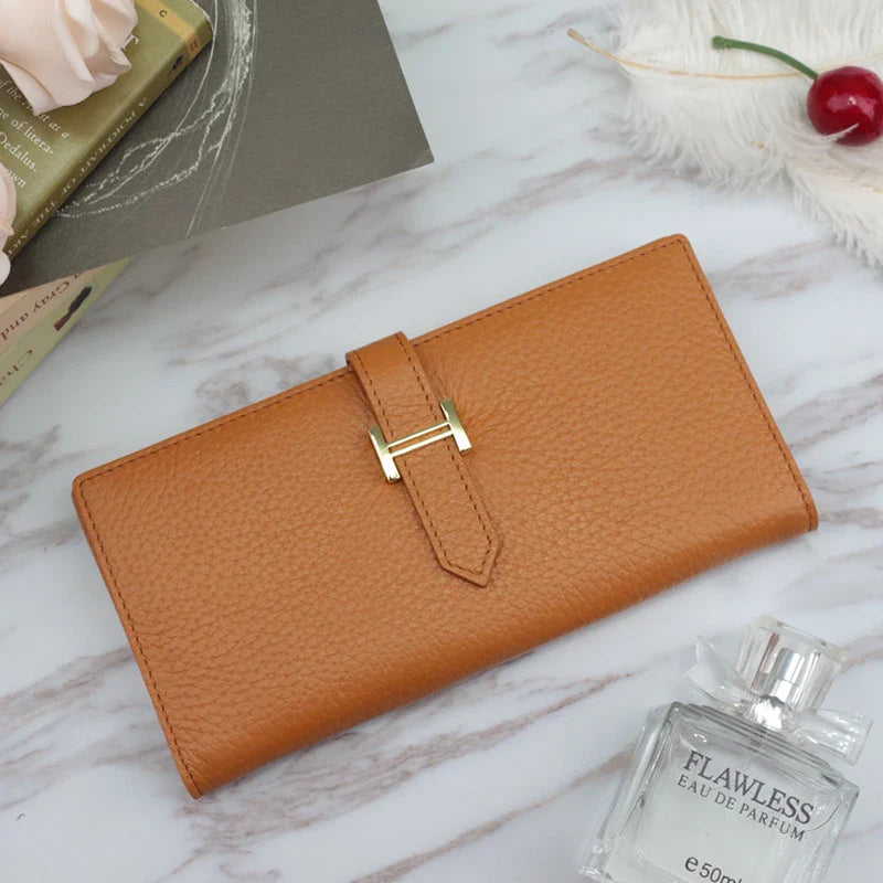 A stylish and practical long wallet made from premium leather, featuring a convenient drawstring closure to keep your essentials organised and secure.