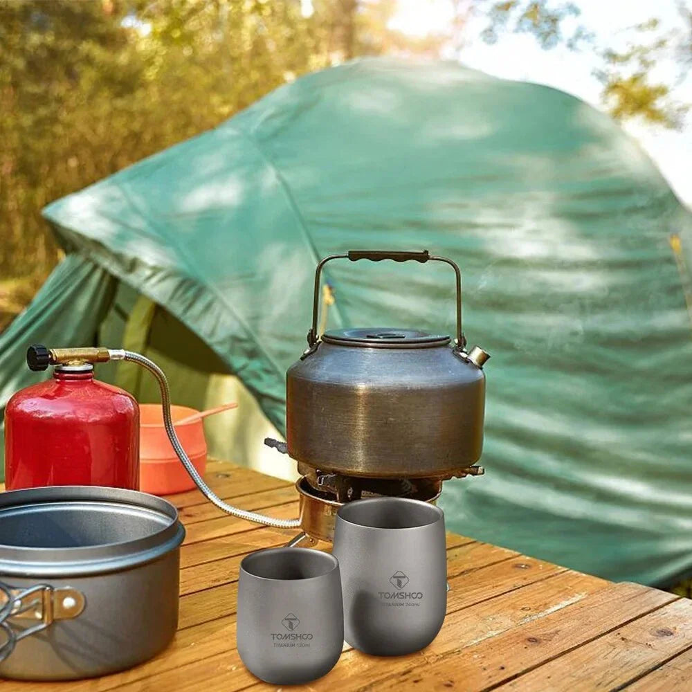 Robust and insulated titanium camping mug with double-wall design for maintaining optimal temperature of hot and cold beverages during outdoor activities