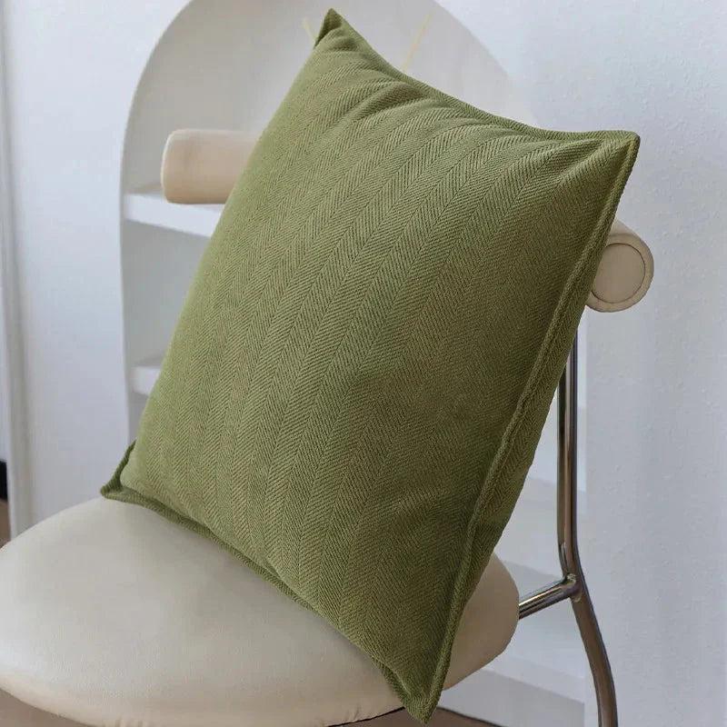 Luxurious cream and green jacquard cushion cover with a unique pattern, measuring 45 x 45 cm for a generous size and impactful presence.