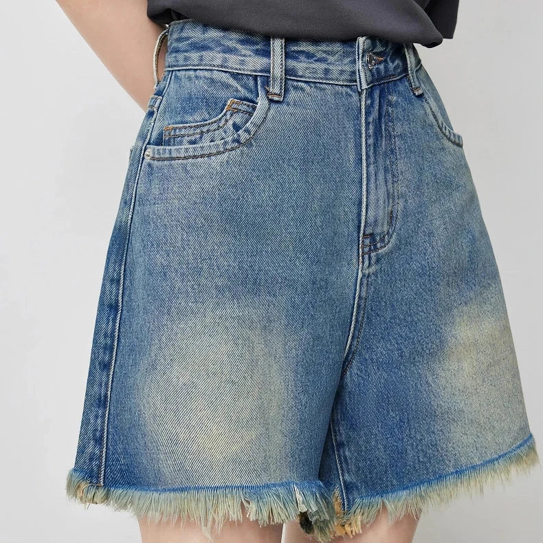 Vintage-inspired high-waisted denim shorts with tassel detailing for women