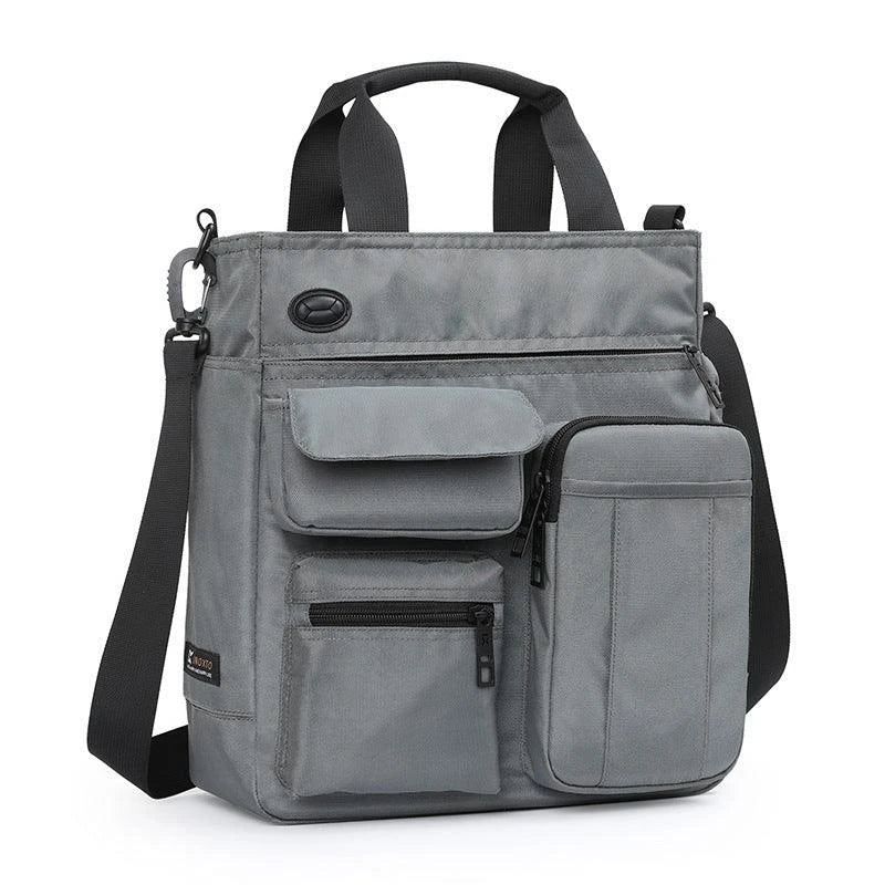 A spacious, versatile shoulder bag in grey colour, designed for business and commuting with a padded laptop compartment