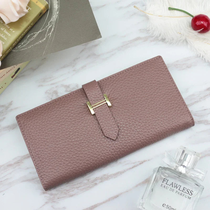 A stylish and practical long wallet made from premium leather, featuring a convenient drawstring closure to keep your essentials organised and secure.